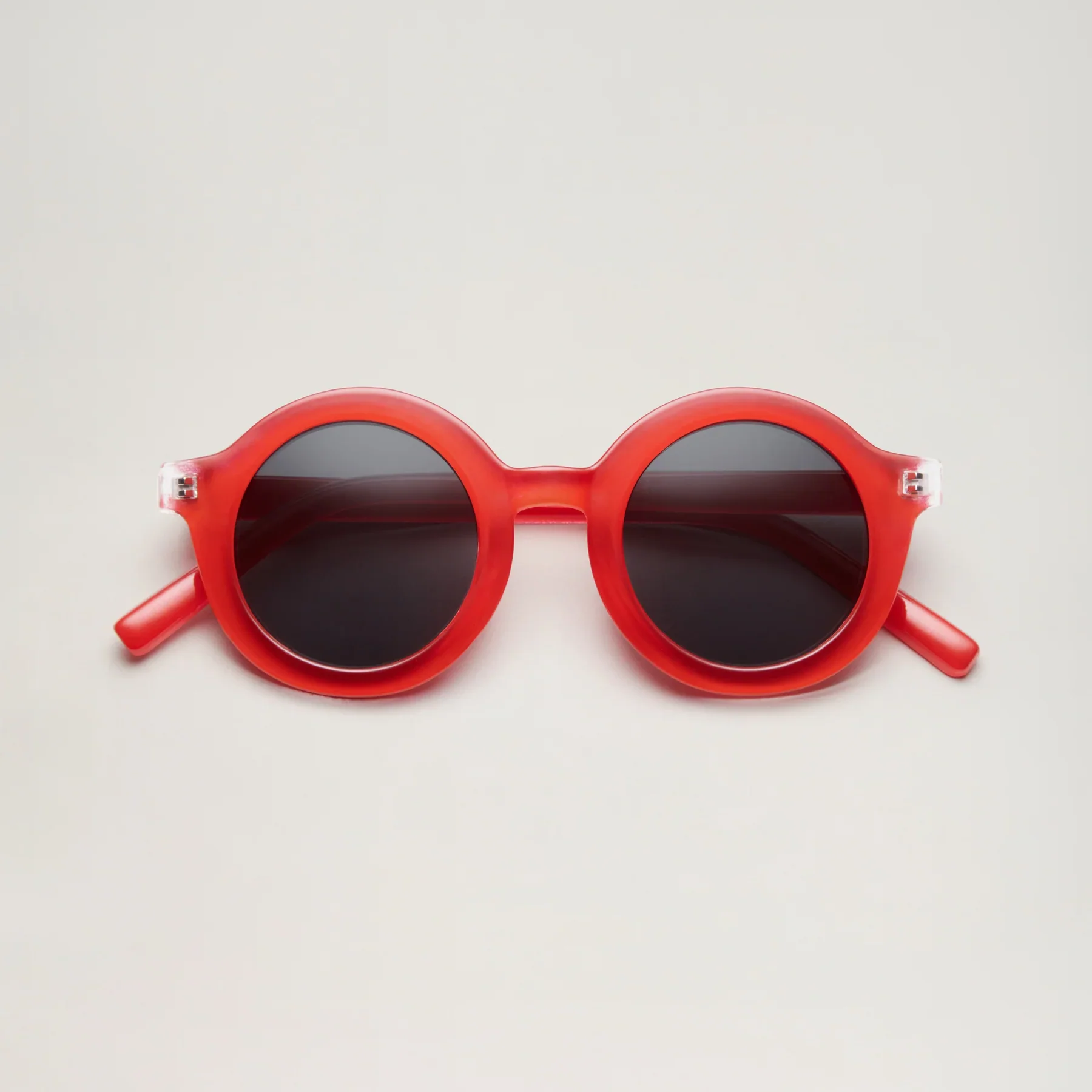 Lunettes de soleil BabyMocs - signature rond rouge